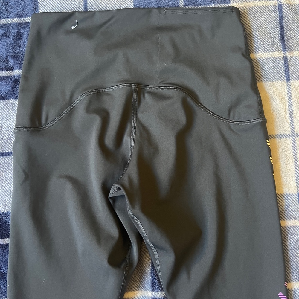 Nike Black Leggings with Purple and Yellow Diagonal Stripe Accents - Picture 9 of 10